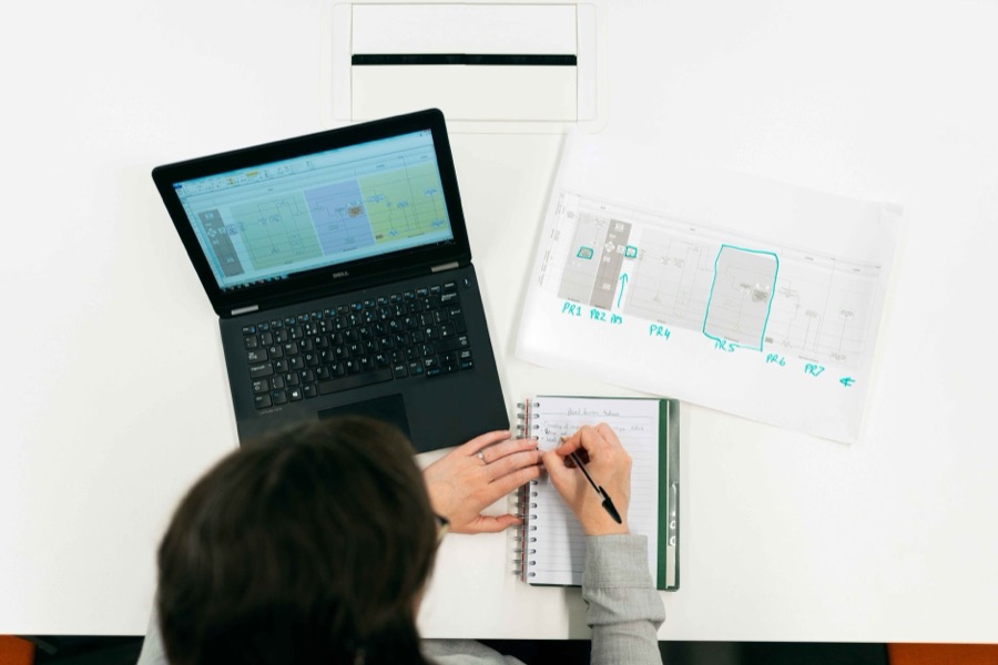 Scientific notes and research workflow materials on a desk